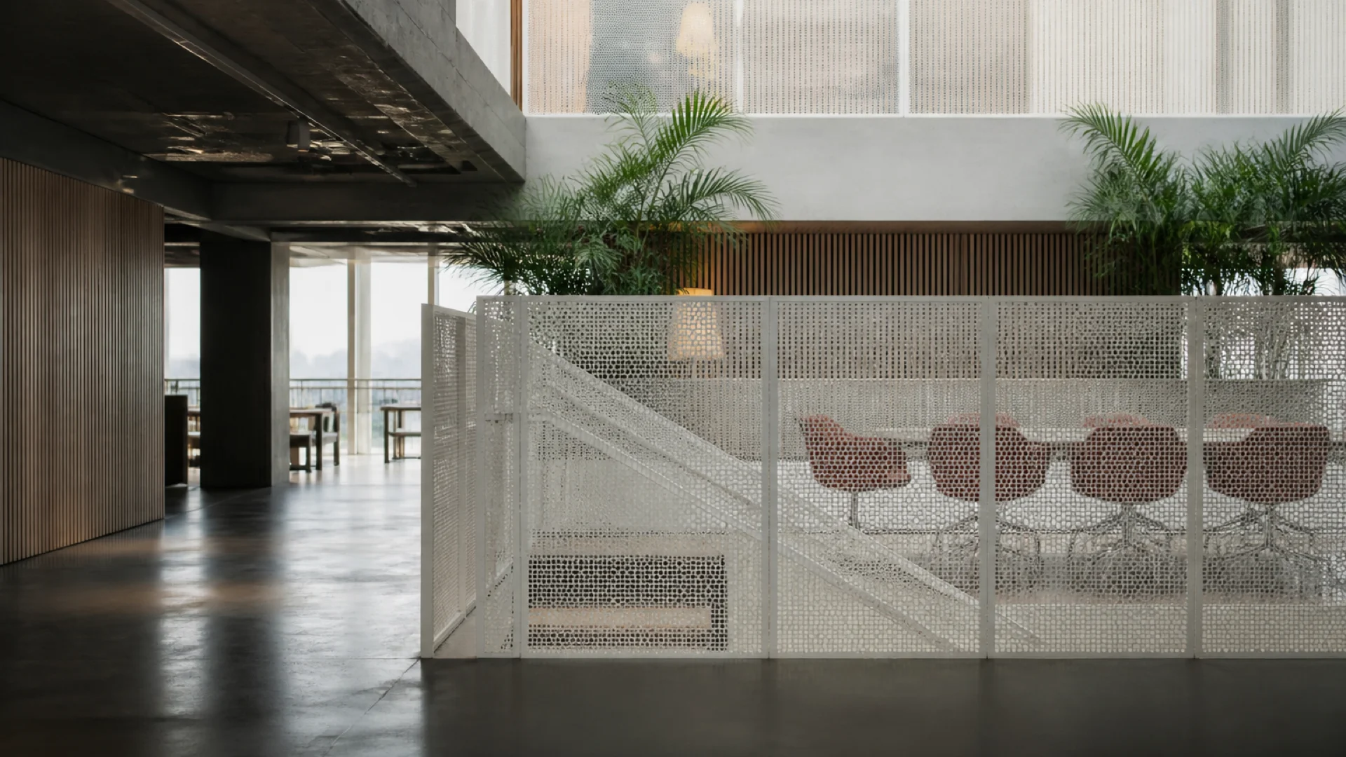 Modern Auviel studio lounge with warm wood and plants
